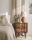 Generated with Kive.ai - Luxury interior photography of a handcrafted solid wood bedside table as the main focal point of a sophisticated Mediterranean-inspired bedroom. The composition is carefully designed so (1).webp
