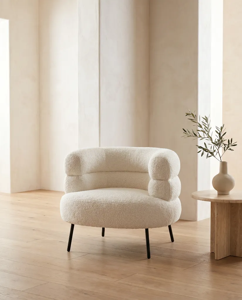 Generated with Kive.ai - White bouclé armchair A high-end Mediterranean contemporary interior featuring a premium designer armchair as the main focal point. The composition is minimalist_ editorial_ and inspire (1).webp